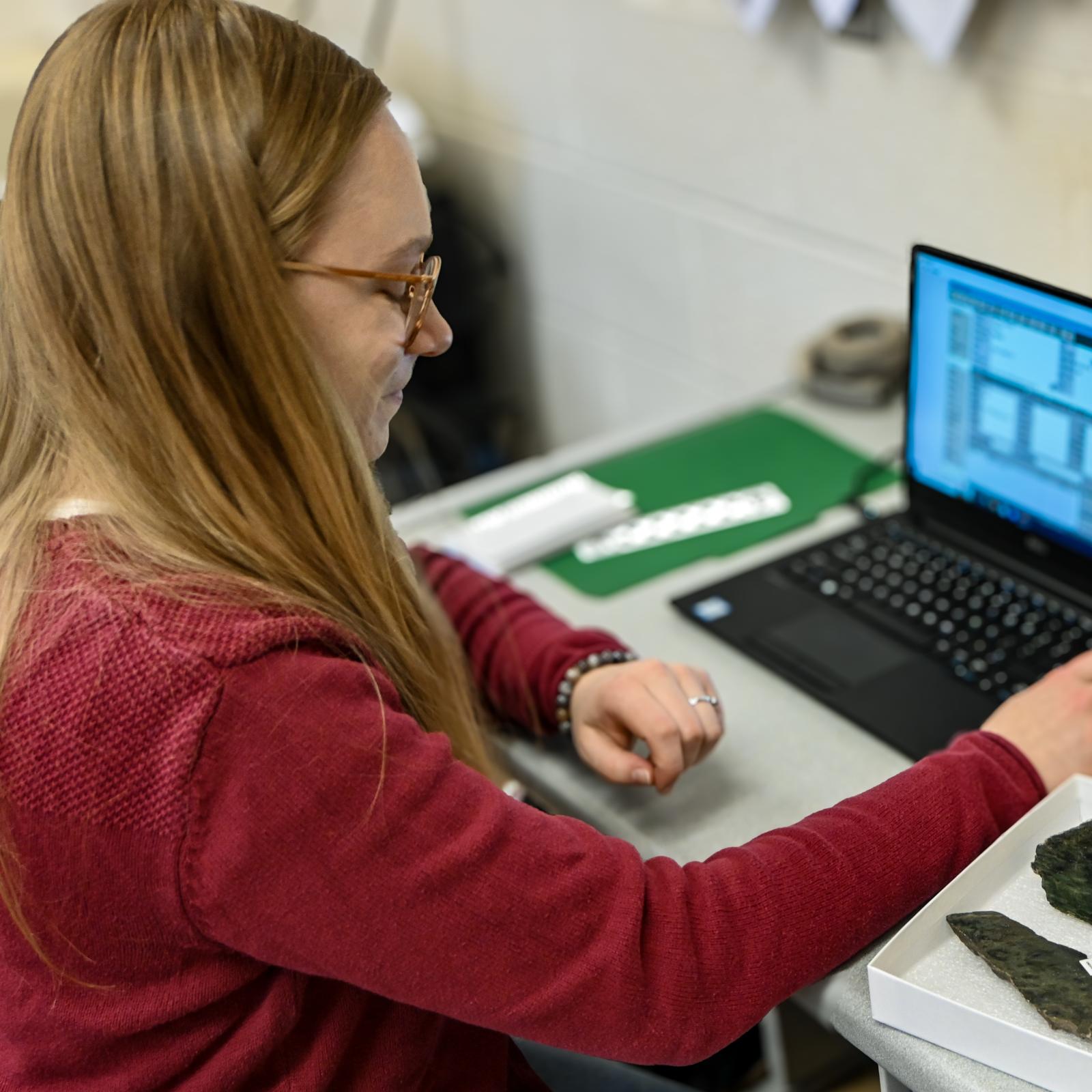 Student intern working in museum collections