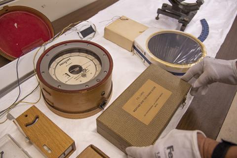 Julianne Snider, managing director of the EMS museum and art gallery, looks over historic meteorological instruments